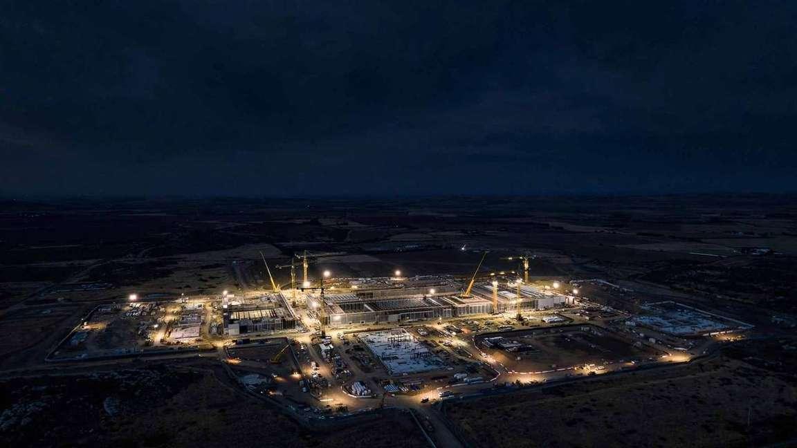 An aerial night view of a data center construction site.